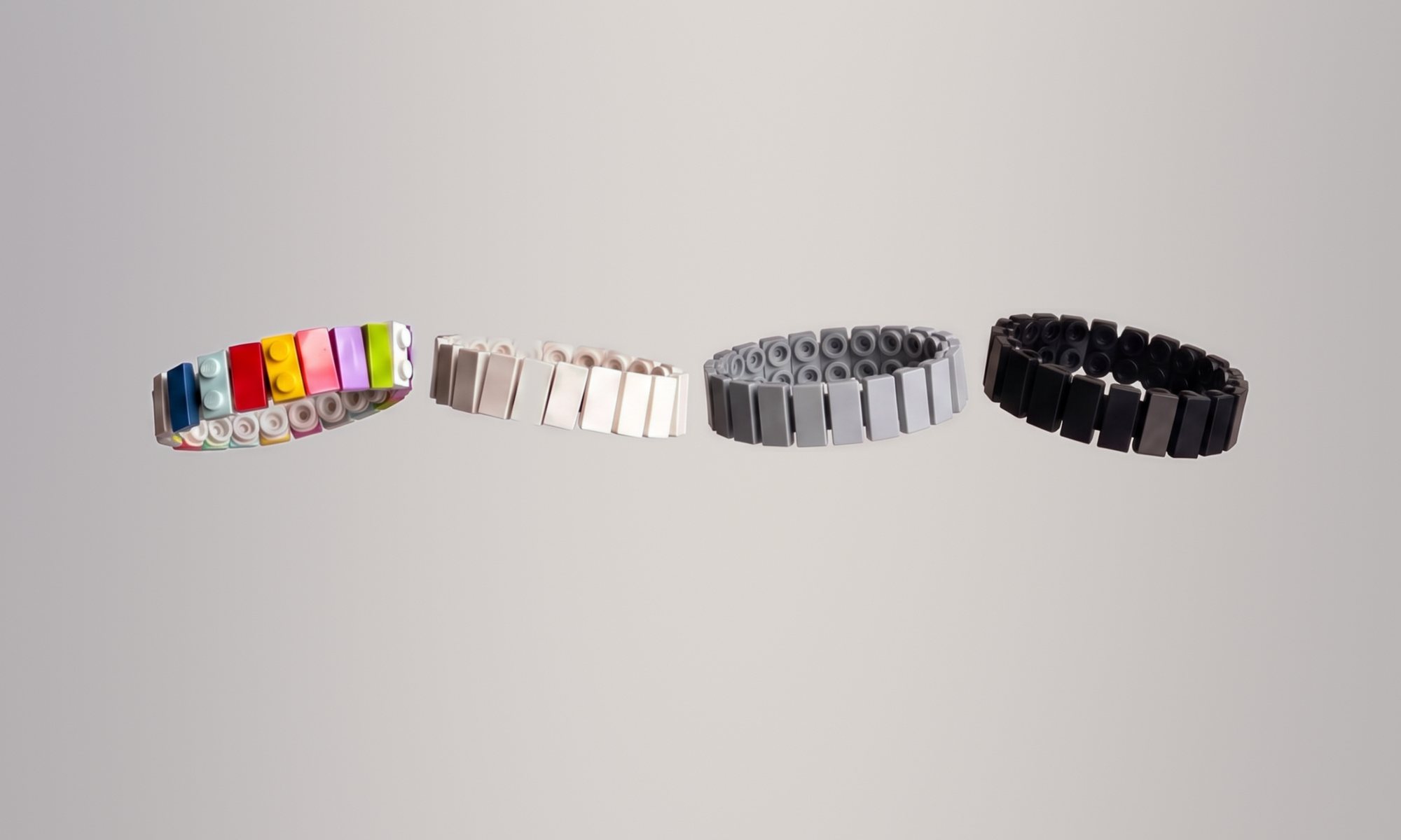 Four Double Brick Charm Bracelets floating: multicolour, white, grey and black